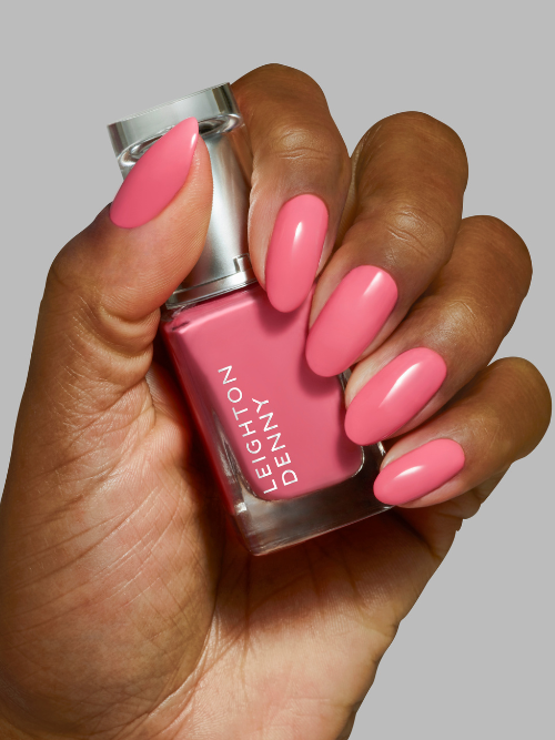 Just Perfect pink with a touch of apricot nail colour on nails close up