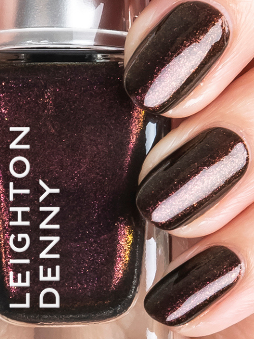 A deep burgundy metallic nail polish on nails