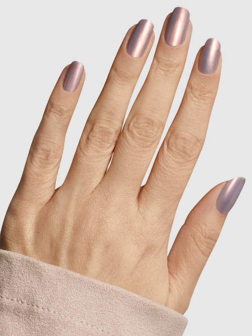 Glazed and Unfazed vegan nail colour on nails cuff shot - lilac iridescent full coverage nail colour with a rose gold shift. 