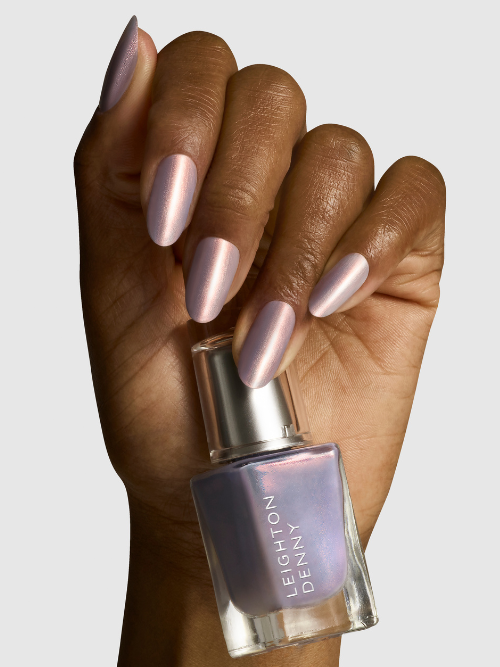 Glazed and Unfazed vegan nail colour on nails with bottle - lilac base with rose gold undertones for a glazed donut look.