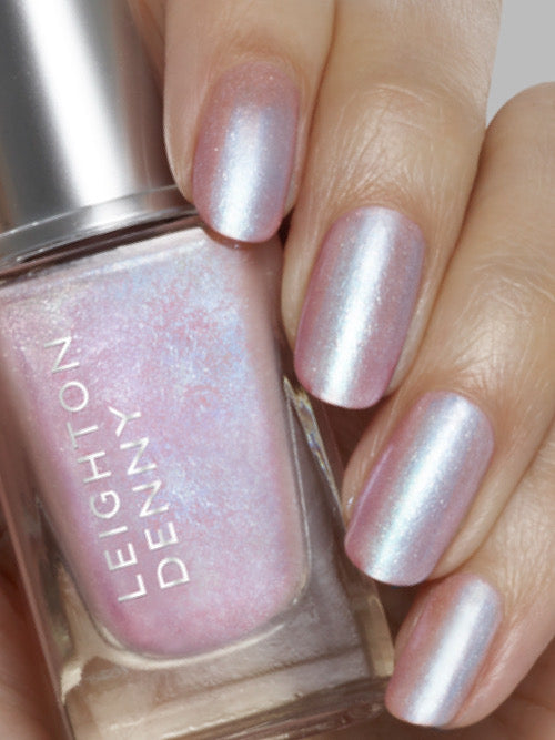 Power To Change semi opaque, shimmery-pink nail colour on nails with bottle