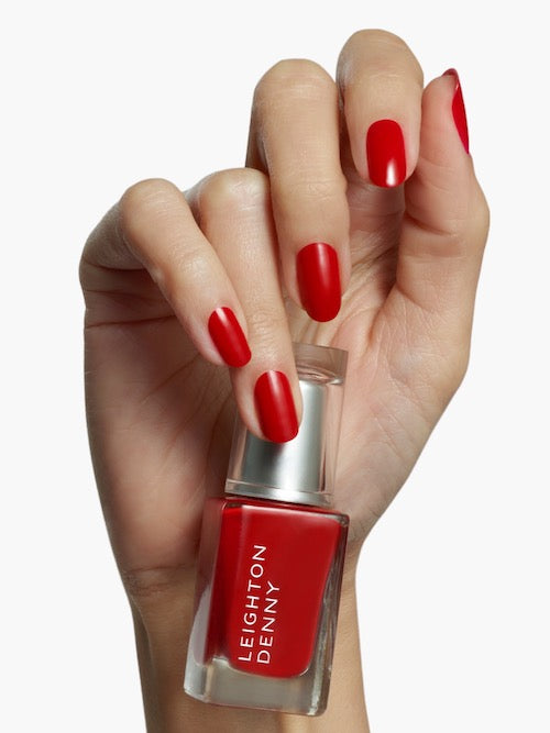 Provocative pillar box red nail colour on nails