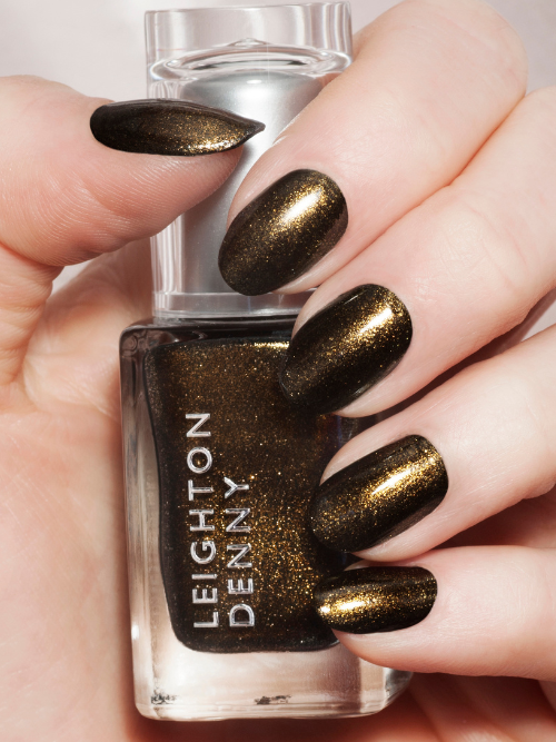 Starlet nail polish on nails. A metallic antique gold.